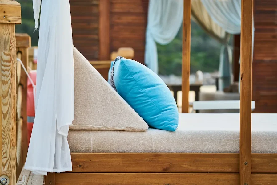 Blue pillow paired with wooden furniture