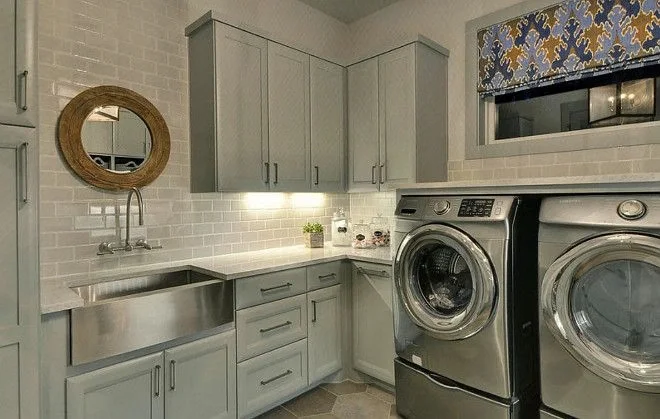 farmhouse vintage sink placed in a laundry room