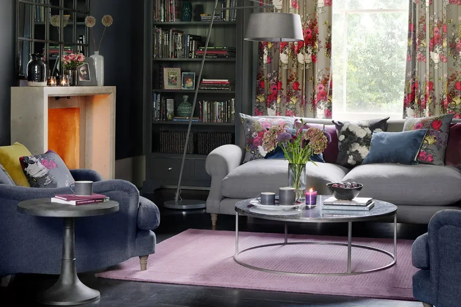 purple rug and gray couch