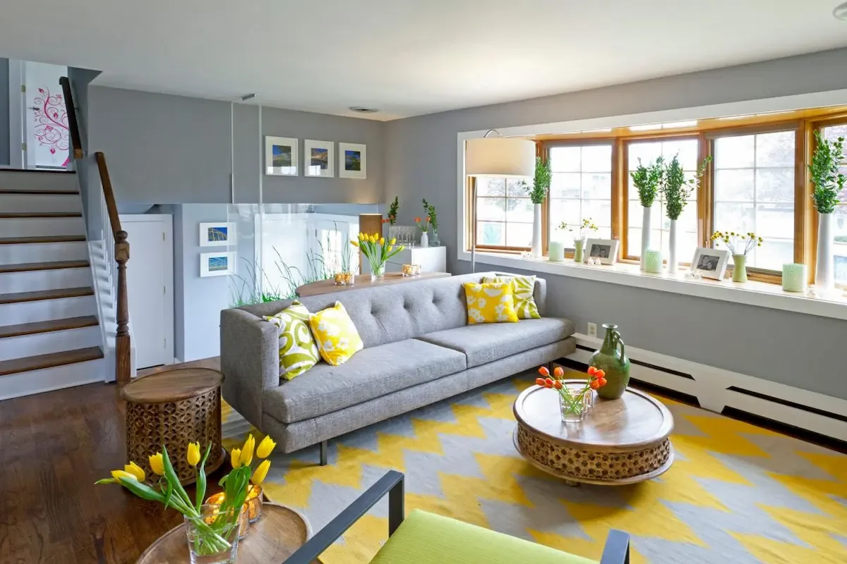 yellow rug with gray couch